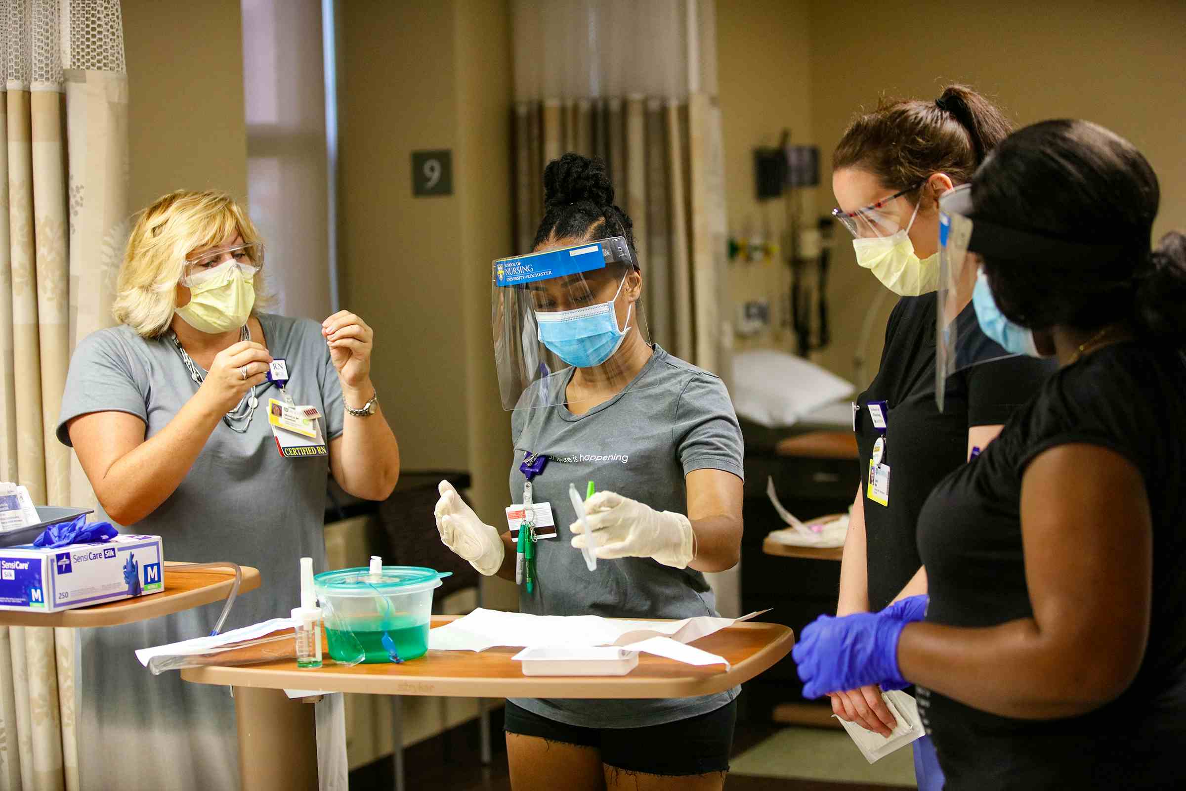 Faculty teaching a nursing students in the skills lab.