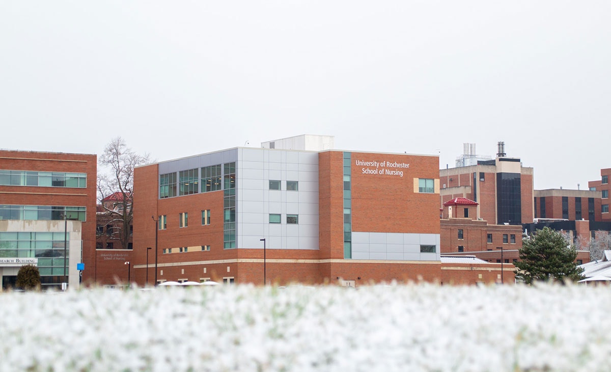 University of Rochester School of Nursing building and Medical Center in the background with snow