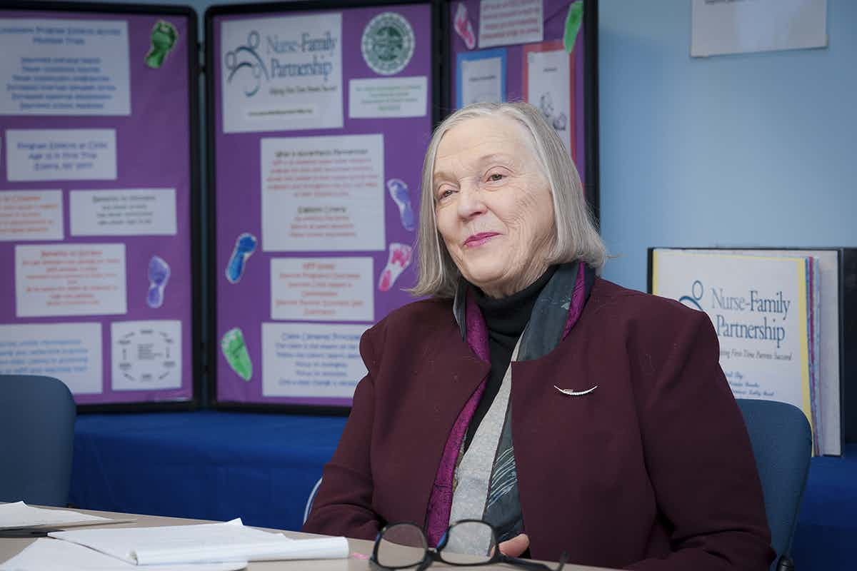 Harriet Kitzman sitting at a table