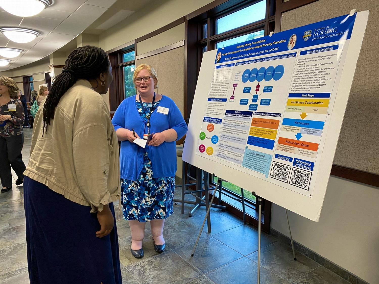 Faculty member presents during Experiential Learning Summit poster session