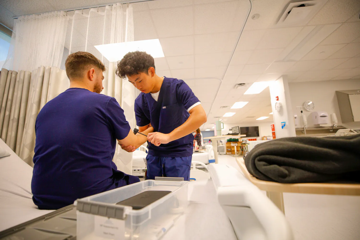 Master's nursing students practicing in skills lab