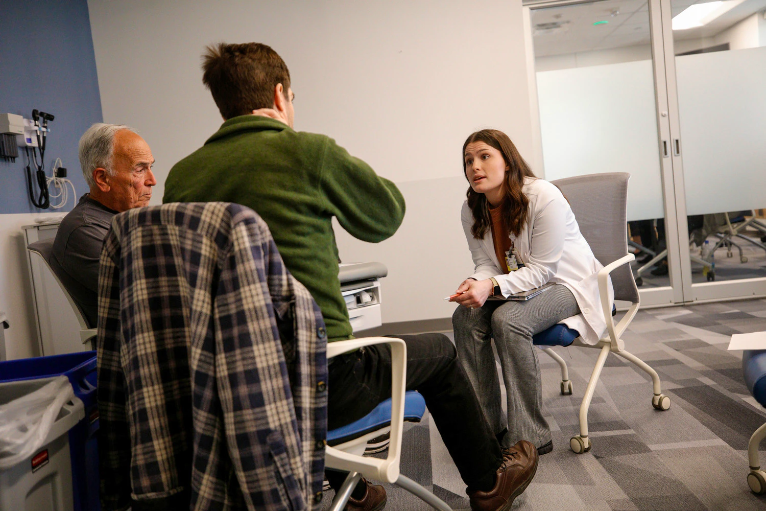NP student conversing with patients during a standardized patient simulation
