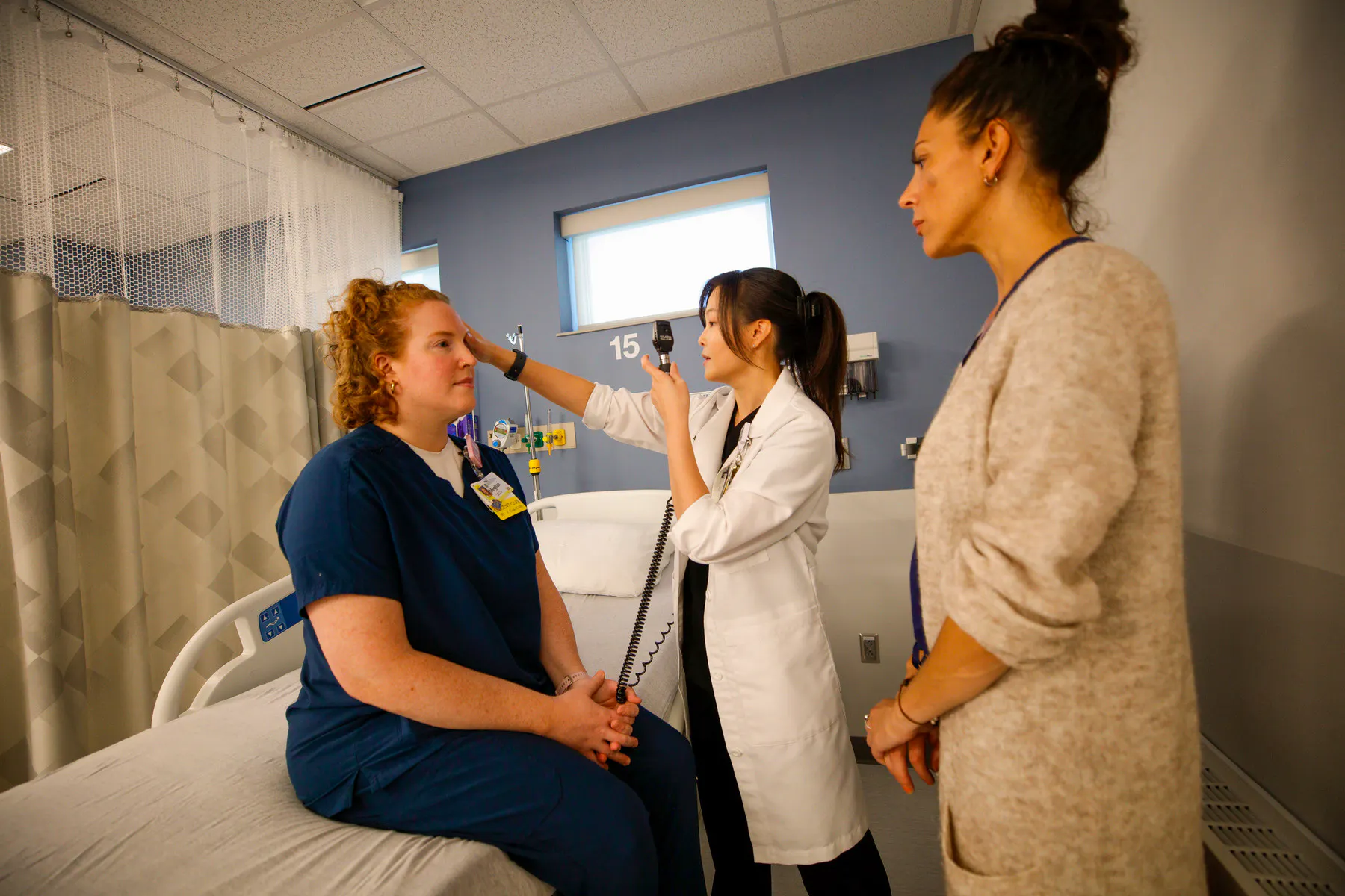 Faculty instructs nursing student