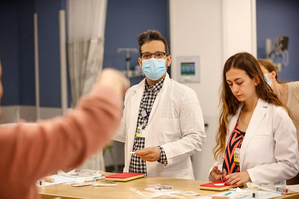 Nurse Practitioner Students suturing in Skills Lab