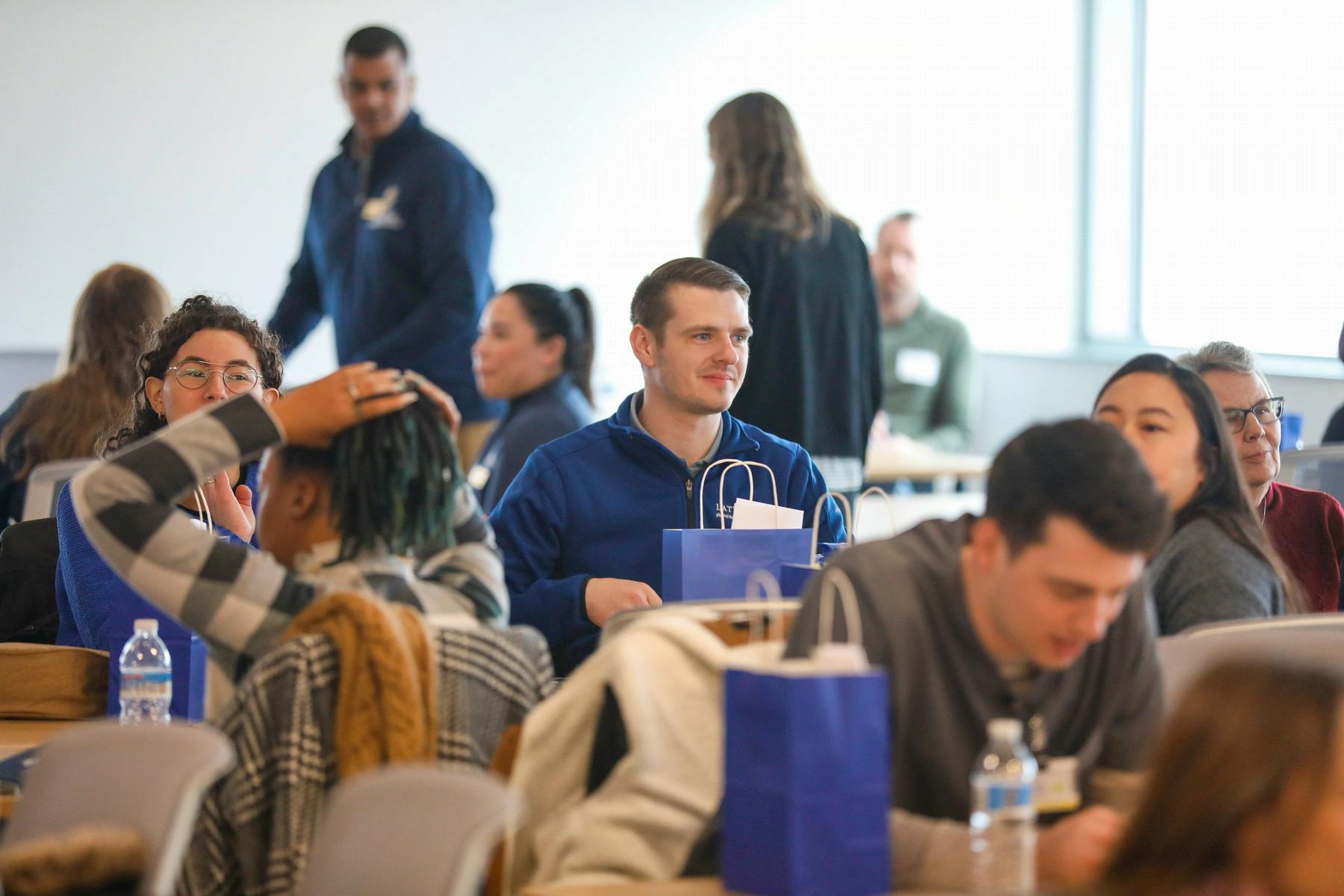New nursing students sitting together during an Orientation event