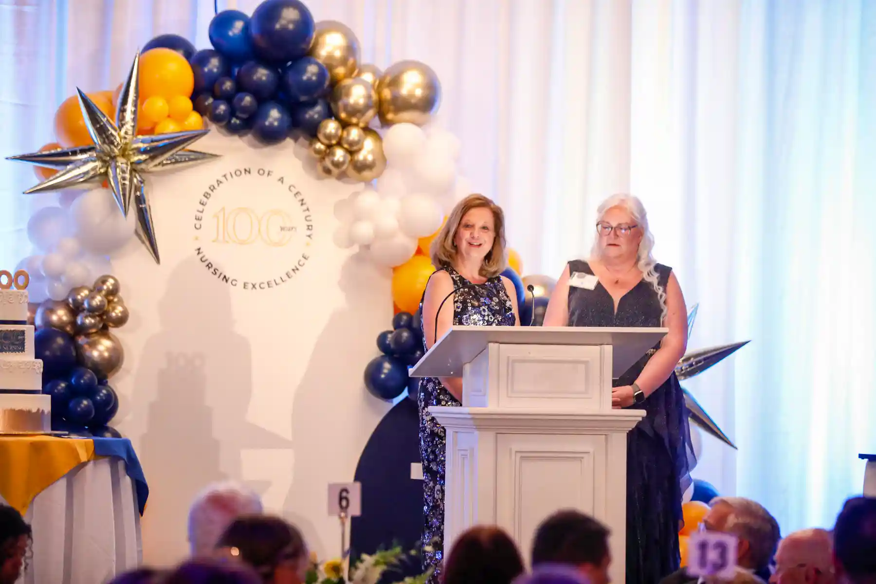 Dean Kitko and chief nursing officer Kate Valcin at the event podium