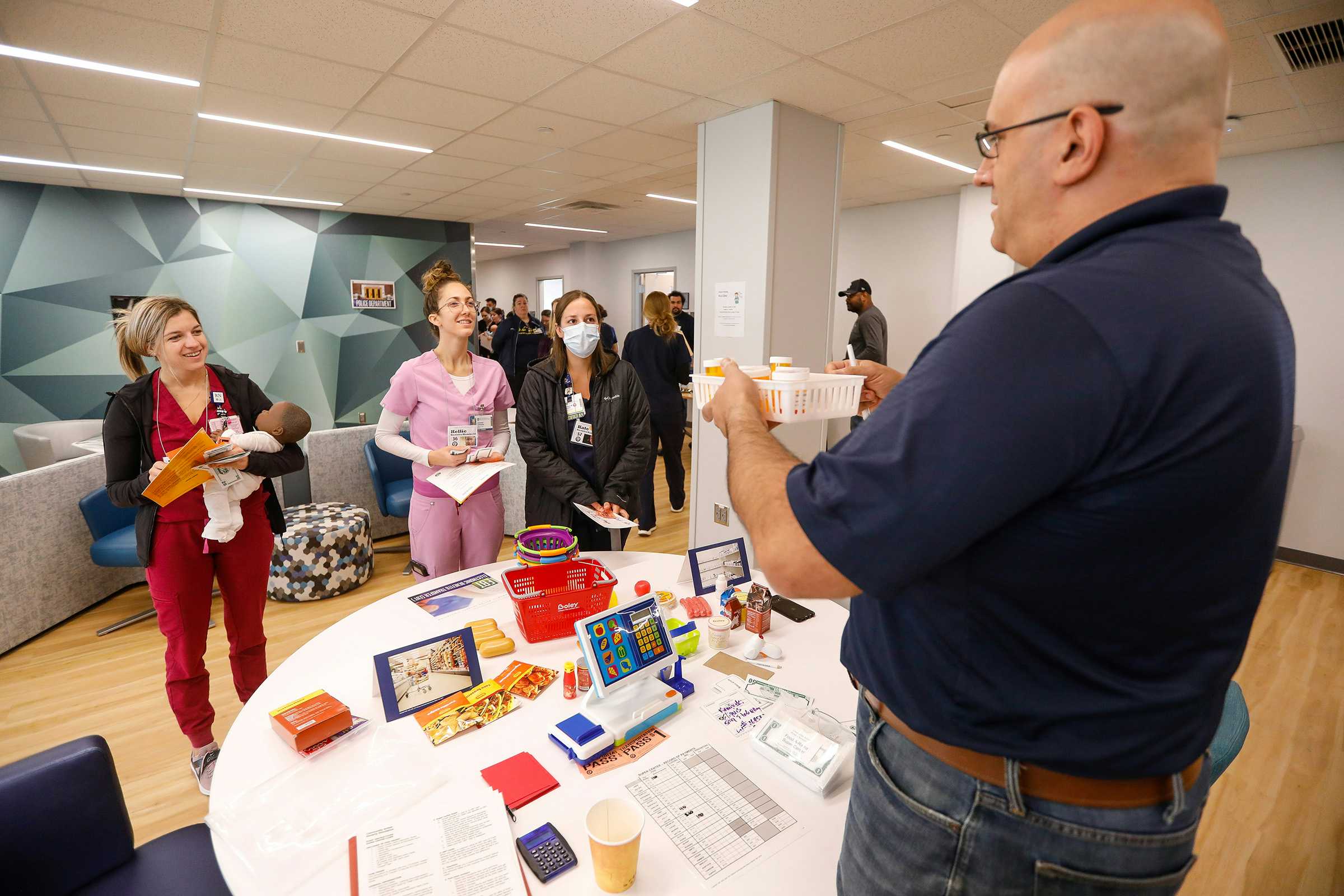 Students and faculty at a mock grocery store during the School of Nursing's poverty simulation in Fall 2022.