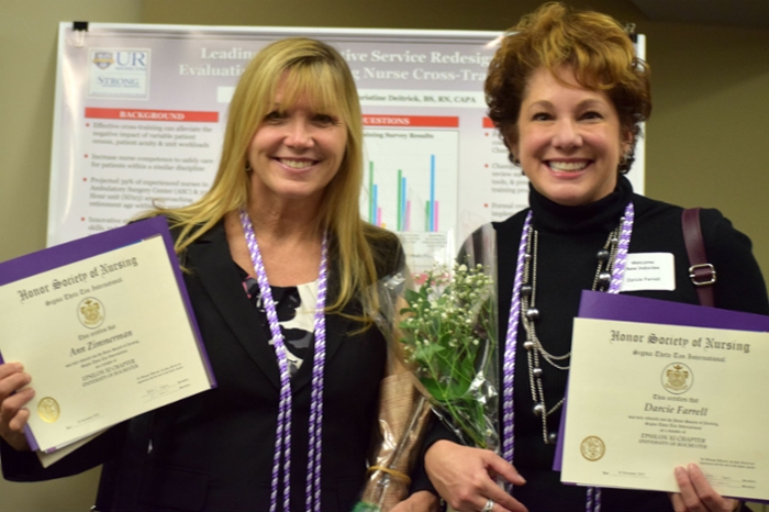 Ann Zimmerman and Denice Farnell holding their Sigma Awards