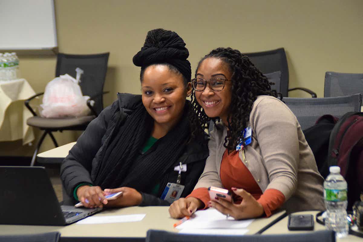 Two UR nursing students smiling in the classroom