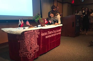 Student at sign up table