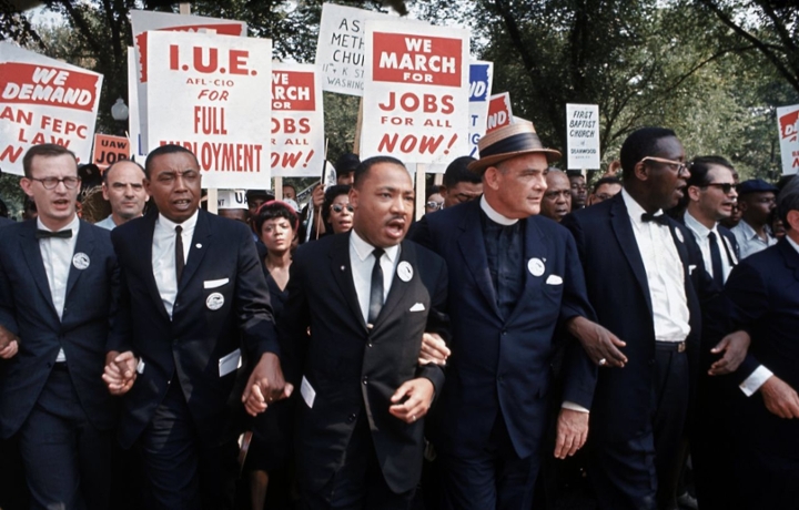 Dr. Martin Luther King Jr. (center) interlocks arms and hands with leaders at the 1963 March on Washington, where he gave his famous "I Have a Dream" speech at Lincoln Memorial. (Getty Images)