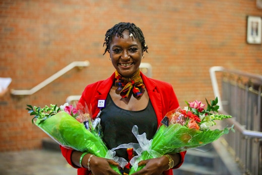 Patterson holding flowers