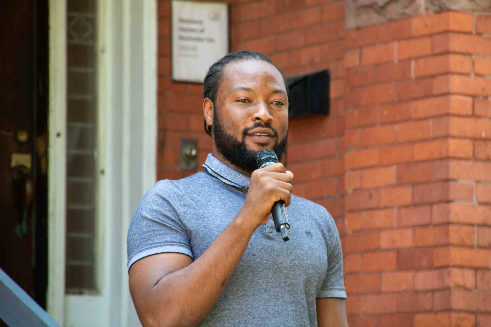 Gamji Abu-Ba'are, PhD, MA, speaking at the Rochester Recovery House