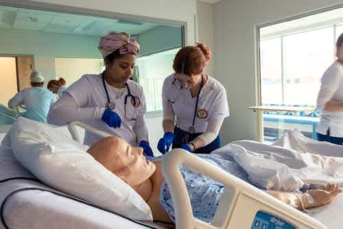 Two ABSN students in simulation.