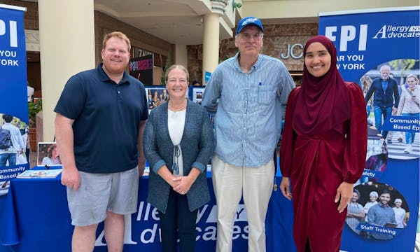 Branson speaks at a mall with fellow Allergy Advocates volunteers. 