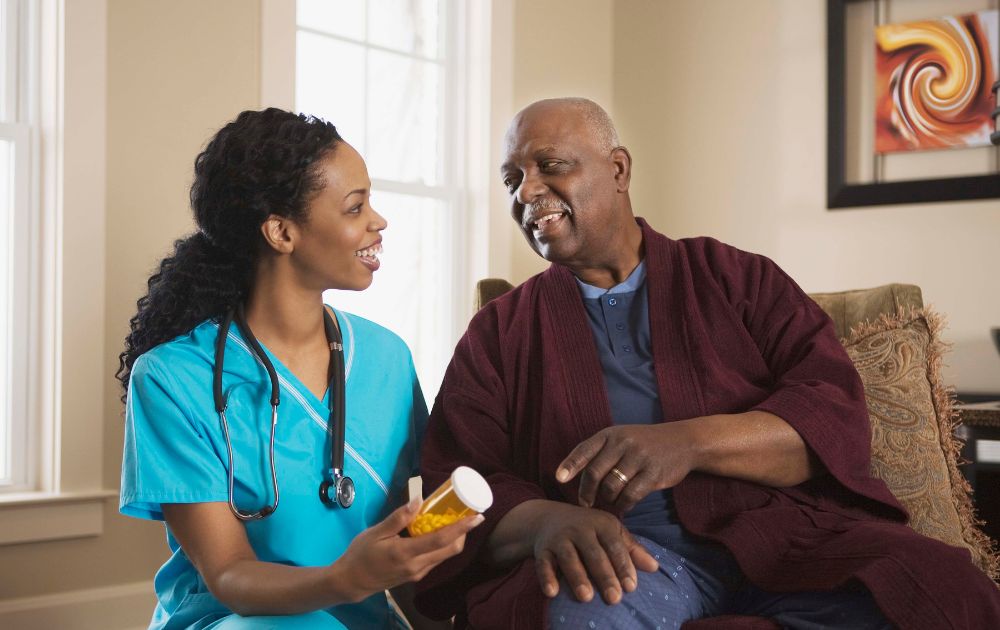 Nurse and an older adult patient talk about a medication.