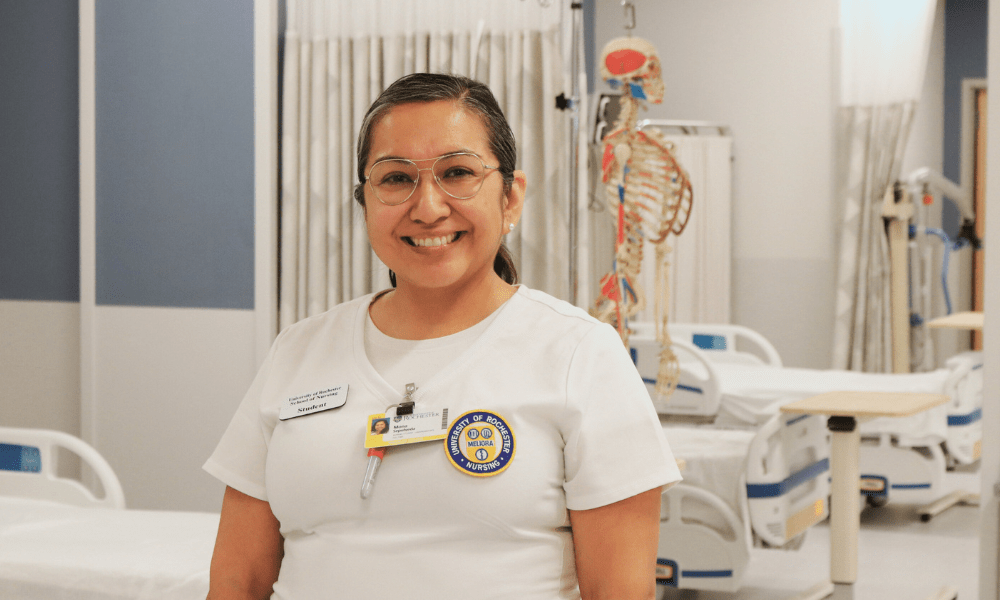 UR Nursing Scholars student Mona Sepulveda, smiling in the School's state-of-art skills lab.