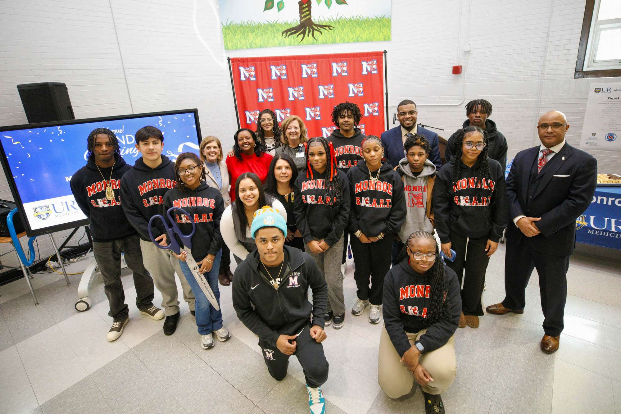 Monroe High School students with School of Nursing and RCSD leadership at the opening of its new Health Center.
