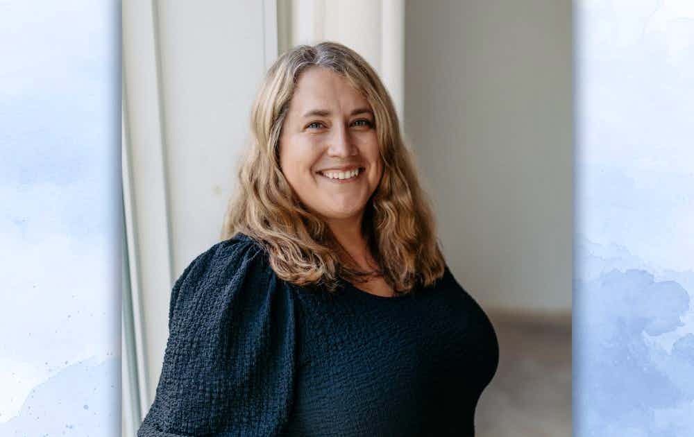 Headshot of Claire Conwell over a white and blue watercolor background