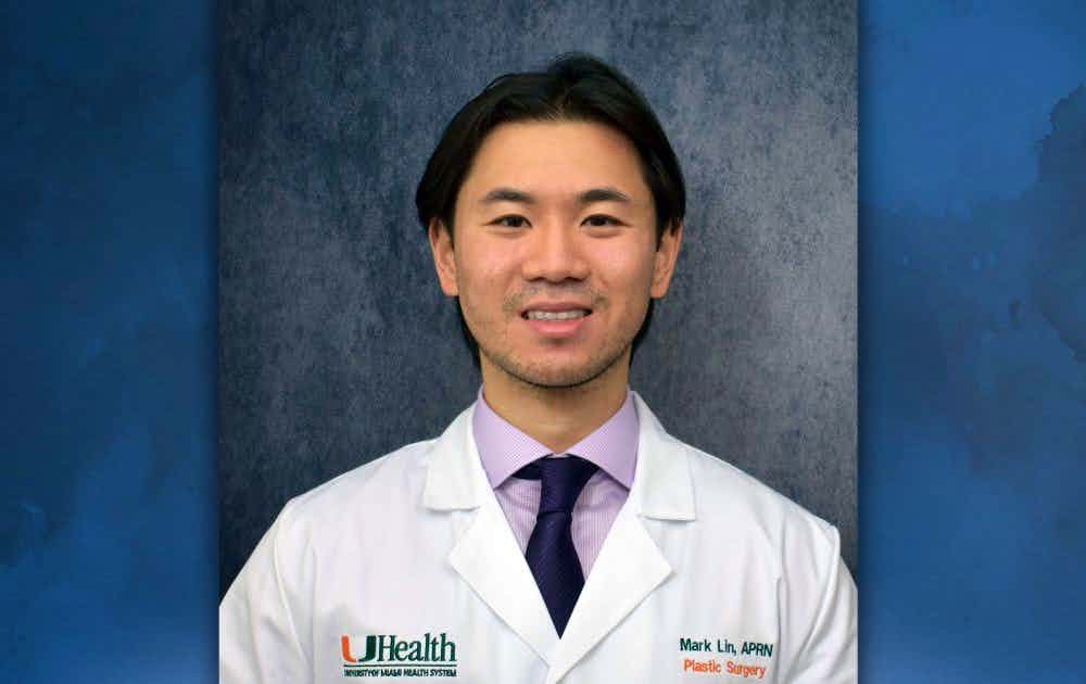 Headshot of Mark Lin over a blue watercolor background