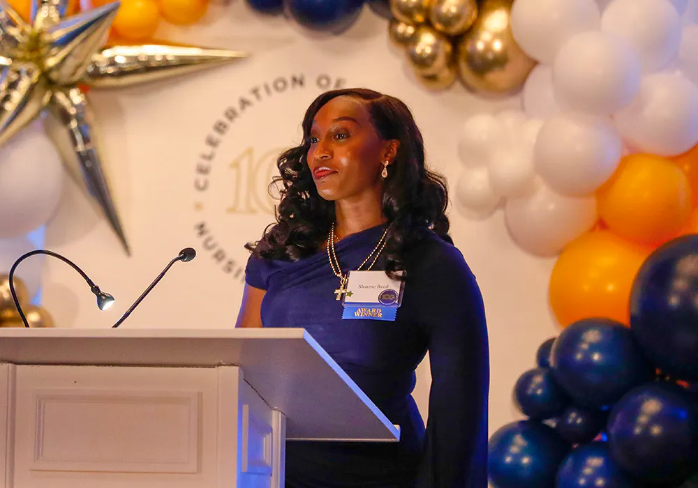 Sharese Reed, RN receiving the Clinical Excellence Award