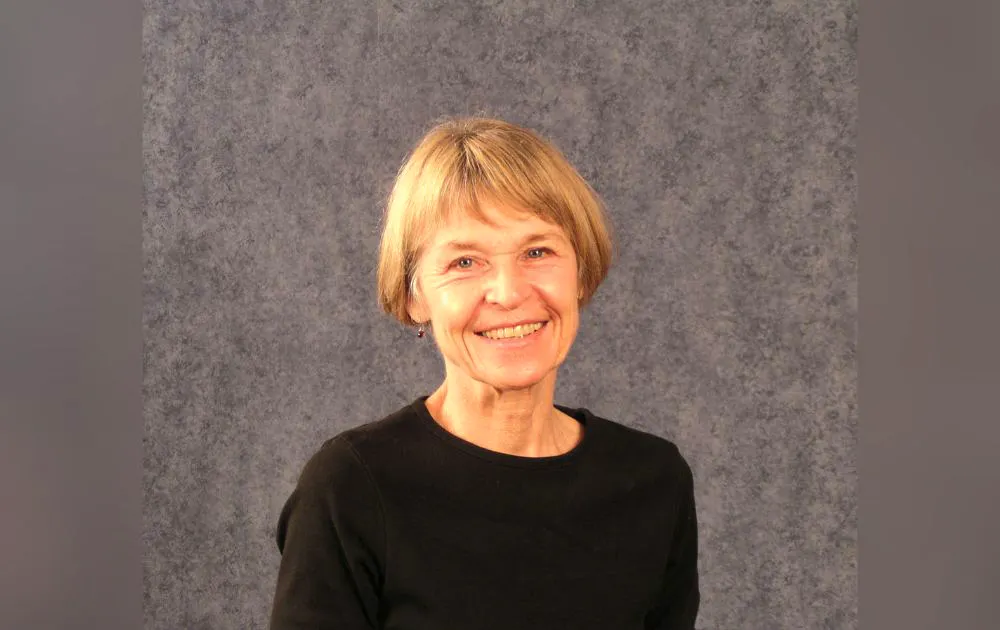 Lorrie Yoos headshot with a gray background