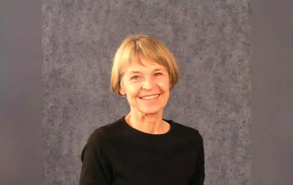Lorrie Yoos headshot with a gray background