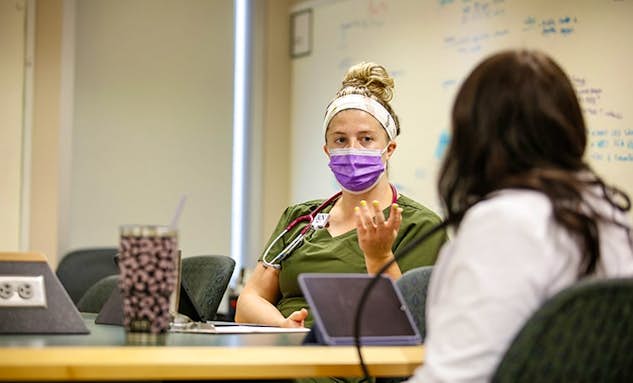 Nurse practitioner student with mask in the classroom