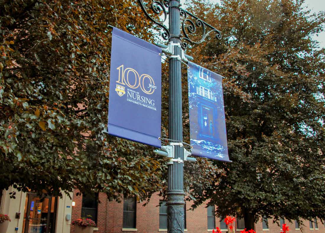Centennial banners in front of Helen Wood Hall